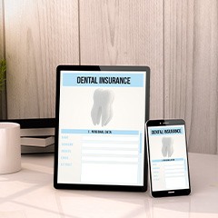 Dental insurance forms on tablet and phone