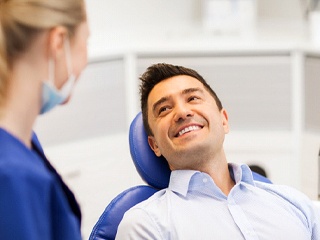 young man smiling during dental cleaning in Ponte Vedra Beach