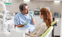 Dentist talking to patient about tooth extraction