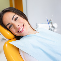 Woman smiling while relaxing in treatment chair