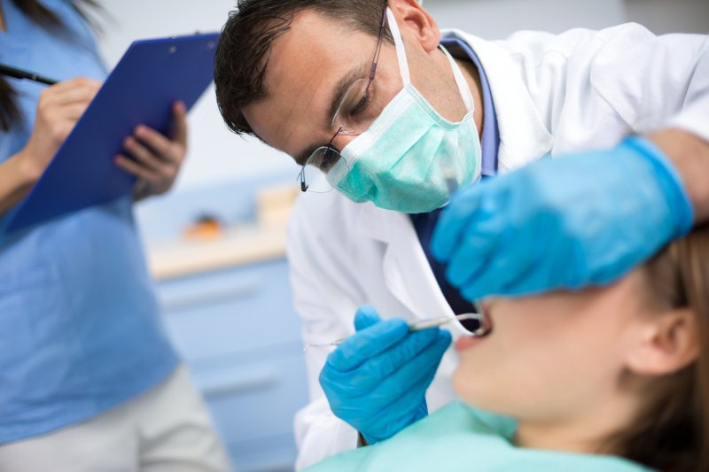 A dentist working on a patient.