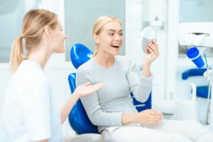 Happy woman visiting cosmetic dentist in Ponte Vedra Beach