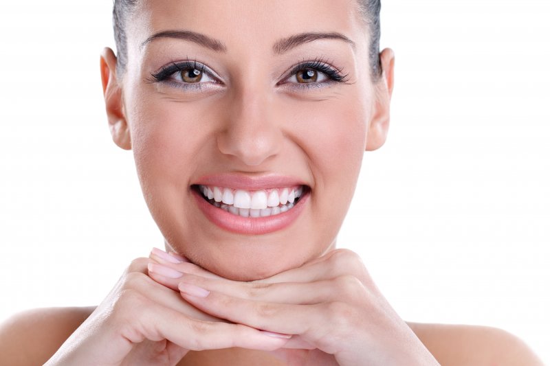 young woman smiling after cosmetic dentistry