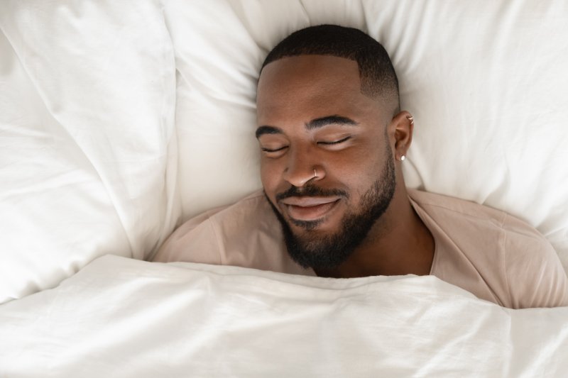 man with oral appliance for sleep apnea