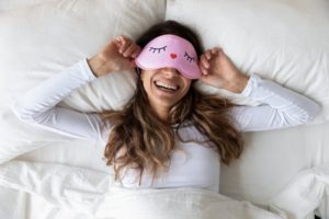 Woman sleeping in bed.