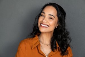 A woman showing off her smile.