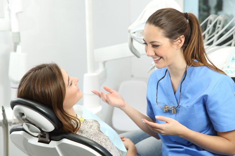 patient speaking to dentist at cosmetic dental consultation