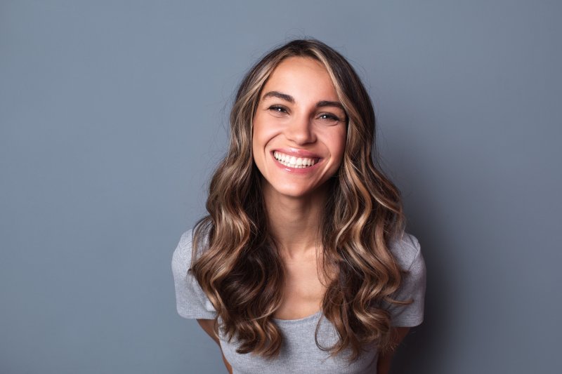 person with porcelain veneers smiling