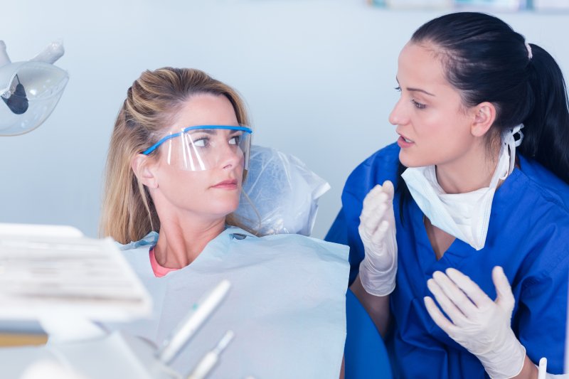 patient visiting dentist for tooth-colored filling