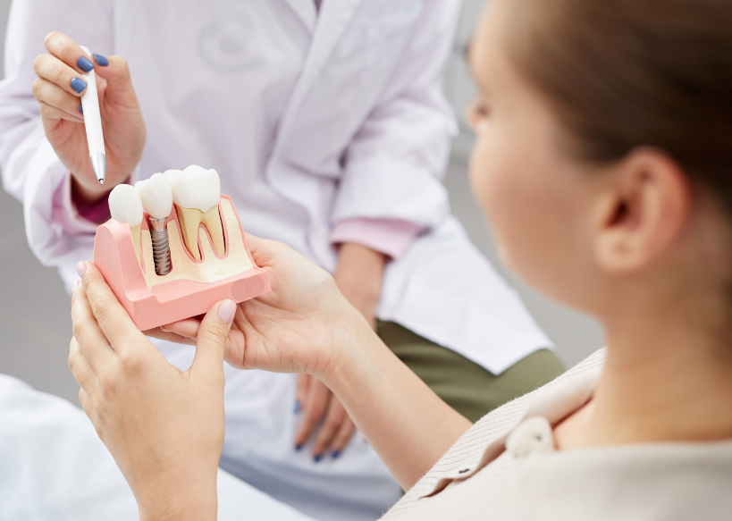 Patient with dental implant model