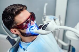 Man getting teeth whitened. 